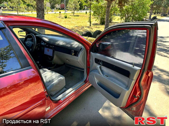 Красный Шевроле Лачетти, объемом двигателя 1.8 л и пробегом 185 тыс. км за 3900 $, фото 8 на Automoto.ua