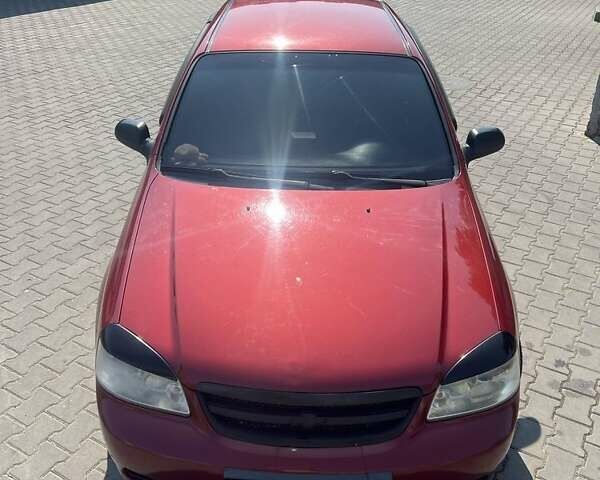 Красный Шевроле Лачетти, объемом двигателя 1.6 л и пробегом 370 тыс. км за 5000 $, фото 5 на Automoto.ua