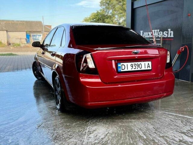 Красный Шевроле Лачетти, объемом двигателя 1.8 л и пробегом 211 тыс. км за 5200 $, фото 2 на Automoto.ua