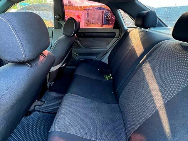 Червоний Шевроле Лачетті, об'ємом двигуна 1.6 л та пробігом 267 тис. км за 4300 $, фото 12 на Automoto.ua