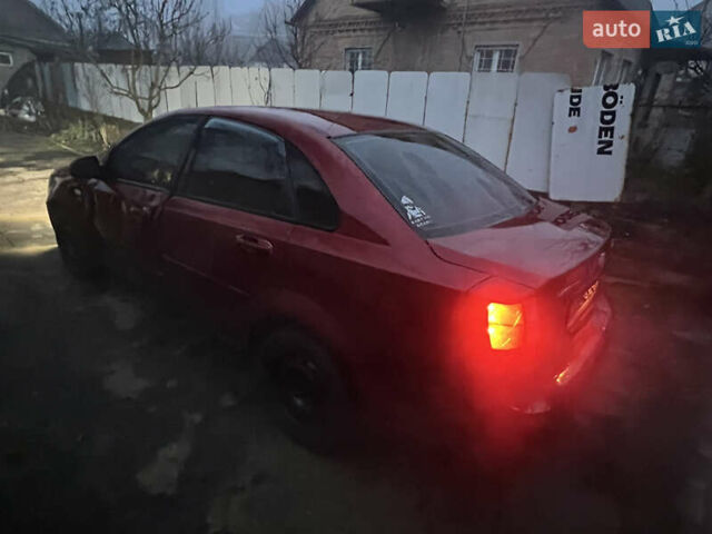 Красный Шевроле Лачетти, объемом двигателя 1.8 л и пробегом 305 тыс. км за 1850 $, фото 3 на Automoto.ua