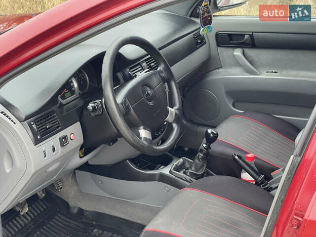 Красный Шевроле Лачетти, объемом двигателя 1.6 л и пробегом 223 тыс. км за 3700 $, фото 21 на Automoto.ua