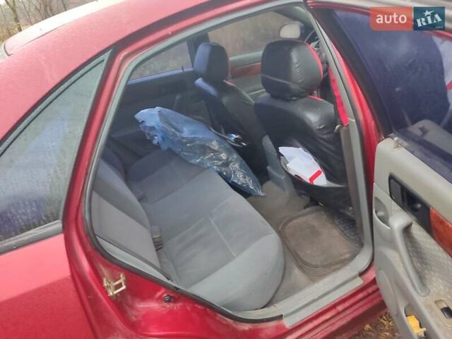 Красный Шевроле Лачетти, объемом двигателя 1.6 л и пробегом 296 тыс. км за 2900 $, фото 6 на Automoto.ua