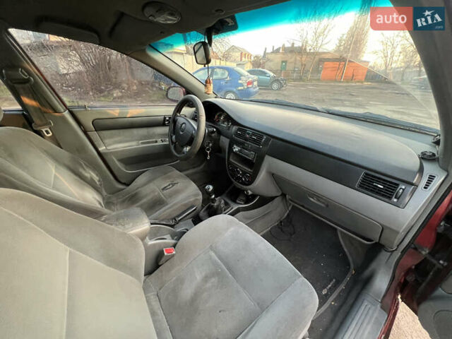 Красный Шевроле Лачетти, объемом двигателя 1.8 л и пробегом 305 тыс. км за 1850 $, фото 8 на Automoto.ua