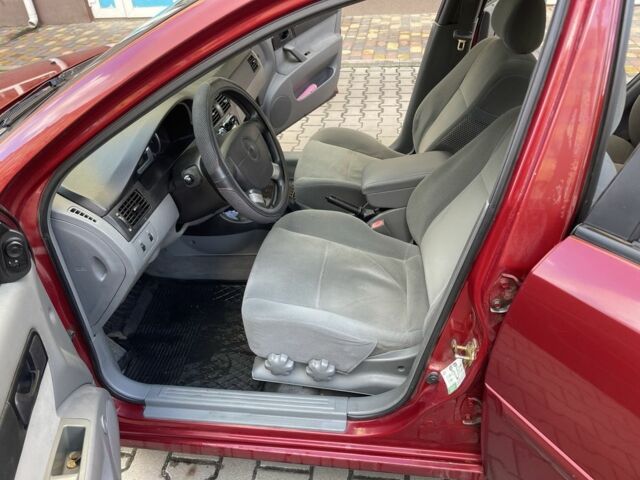 Красный Шевроле Лачетти, объемом двигателя 1.4 л и пробегом 241 тыс. км за 4200 $, фото 1 на Automoto.ua