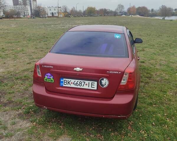 Красный Шевроле Лачетти, объемом двигателя 1.6 л и пробегом 296 тыс. км за 2900 $, фото 2 на Automoto.ua