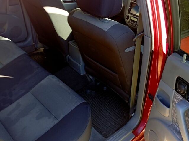 Красный Шевроле Лачетти, объемом двигателя 1.8 л и пробегом 247 тыс. км за 4800 $, фото 1 на Automoto.ua