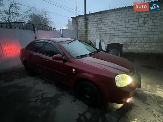 Красный Шевроле Лачетти, объемом двигателя 1.8 л и пробегом 305 тыс. км за 1850 $, фото 1 на Automoto.ua