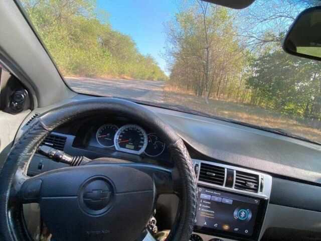 Красный Шевроле Лачетти, объемом двигателя 1.8 л и пробегом 211 тыс. км за 5200 $, фото 8 на Automoto.ua