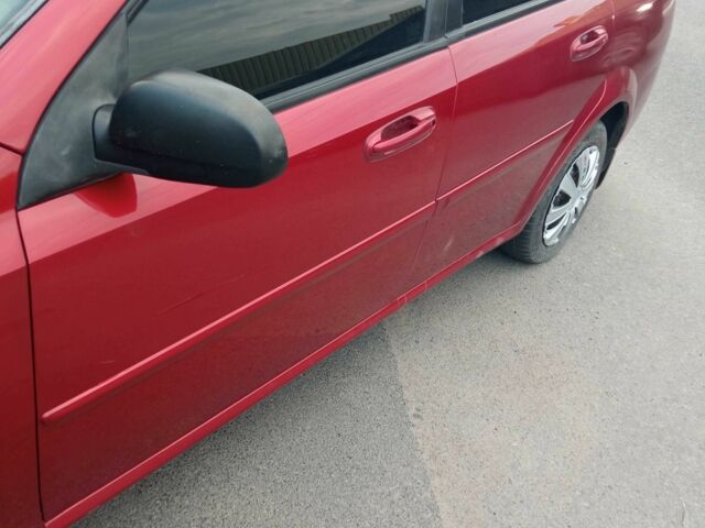 Красный Шевроле Лачетти, объемом двигателя 1.6 л и пробегом 143 тыс. км за 3800 $, фото 7 на Automoto.ua