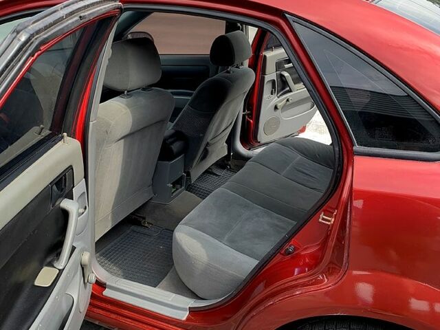 Красный Шевроле Лачетти, объемом двигателя 1.6 л и пробегом 297 тыс. км за 3600 $, фото 8 на Automoto.ua