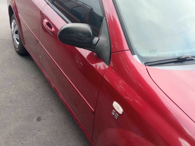 Красный Шевроле Лачетти, объемом двигателя 1.6 л и пробегом 143 тыс. км за 3800 $, фото 8 на Automoto.ua