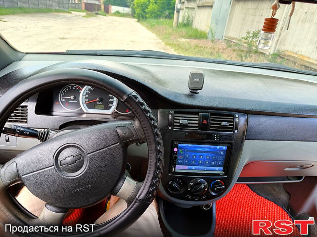 Червоний Шевроле Лачетті, об'ємом двигуна 1.6 л та пробігом 243 тис. км за 3899 $, фото 3 на Automoto.ua