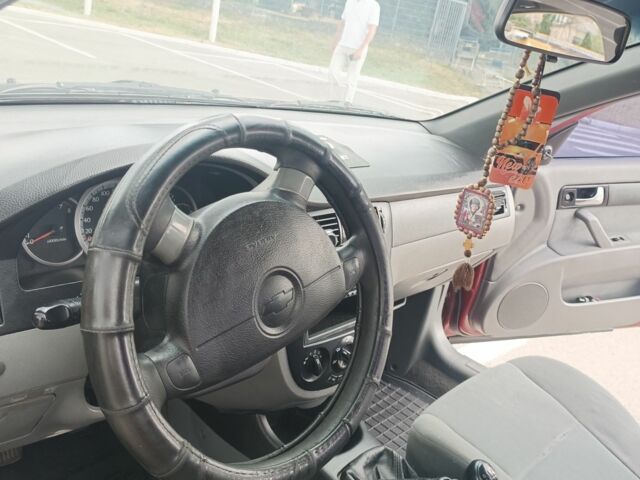 Червоний Шевроле Лачетті, об'ємом двигуна 1.6 л та пробігом 265 тис. км за 3099 $, фото 5 на Automoto.ua