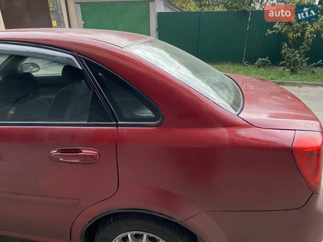 Красный Шевроле Лачетти, объемом двигателя 1.6 л и пробегом 225 тыс. км за 2900 $, фото 7 на Automoto.ua