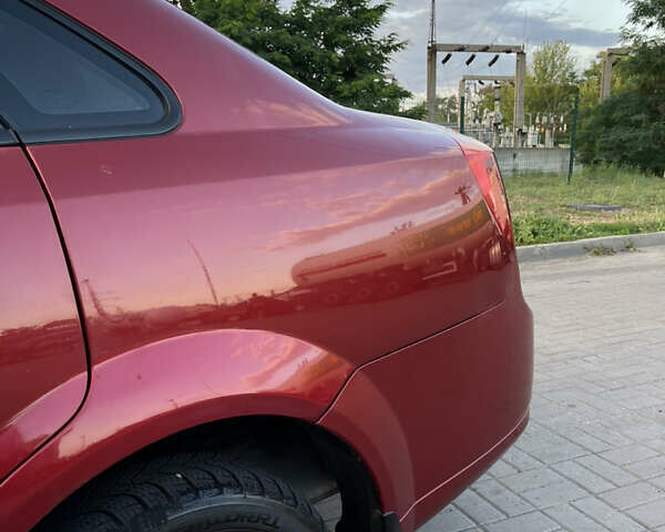 Красный Шевроле Лачетти, объемом двигателя 1.6 л и пробегом 133 тыс. км за 3500 $, фото 5 на Automoto.ua