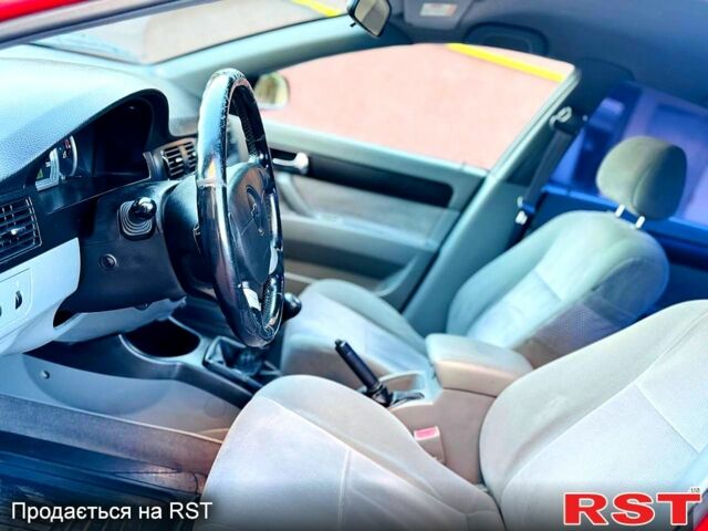 Красный Шевроле Лачетти, объемом двигателя 1.8 л и пробегом 195 тыс. км за 4300 $, фото 1 на Automoto.ua