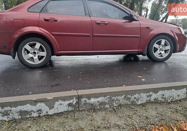 Красный Шевроле Лачетти, объемом двигателя 1.6 л и пробегом 275 тыс. км за 4500 $, фото 8 на Automoto.ua