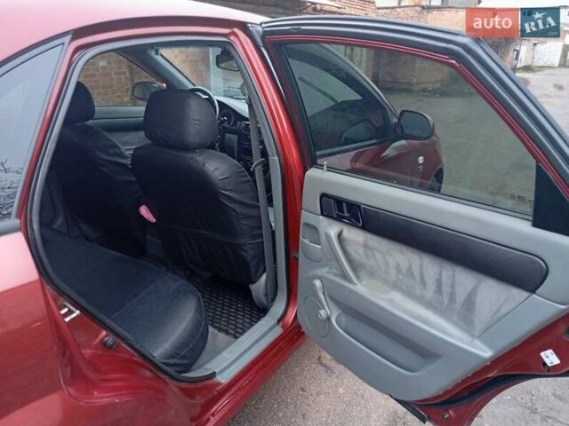 Красный Шевроле Лачетти, объемом двигателя 1.8 л и пробегом 290 тыс. км за 4100 $, фото 15 на Automoto.ua