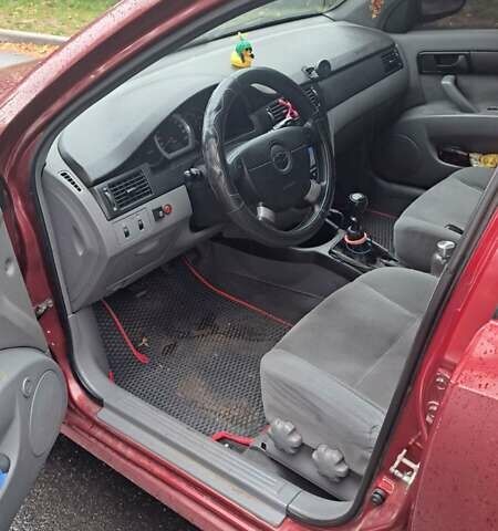 Красный Шевроле Лачетти, объемом двигателя 1.6 л и пробегом 275 тыс. км за 4500 $, фото 6 на Automoto.ua