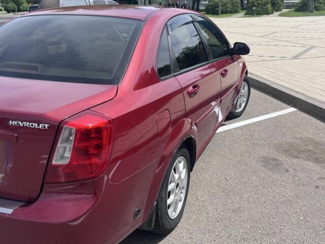 Красный Шевроле Лачетти, объемом двигателя 1.8 л и пробегом 205 тыс. км за 4300 $, фото 2 на Automoto.ua