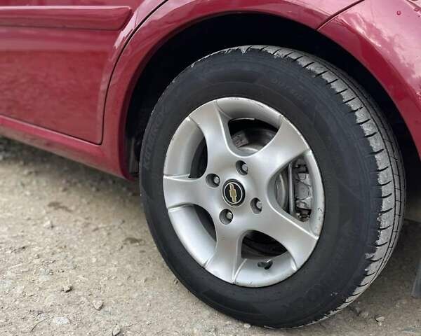 Красный Шевроле Лачетти, объемом двигателя 1.6 л и пробегом 130 тыс. км за 6200 $, фото 21 на Automoto.ua