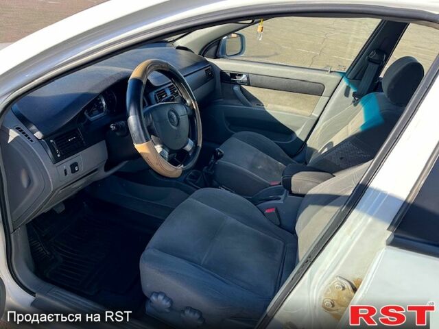 Червоний Шевроле Лачетті, об'ємом двигуна 1.8 л та пробігом 202 тис. км за 3899 $, фото 8 на Automoto.ua