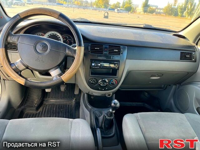 Червоний Шевроле Лачетті, об'ємом двигуна 1.8 л та пробігом 202 тис. км за 3899 $, фото 11 на Automoto.ua