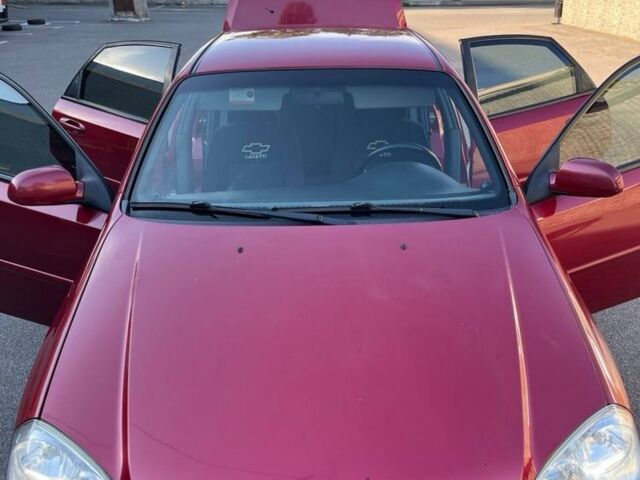 Красный Шевроле Лачетти, объемом двигателя 1.8 л и пробегом 171 тыс. км за 4400 $, фото 6 на Automoto.ua
