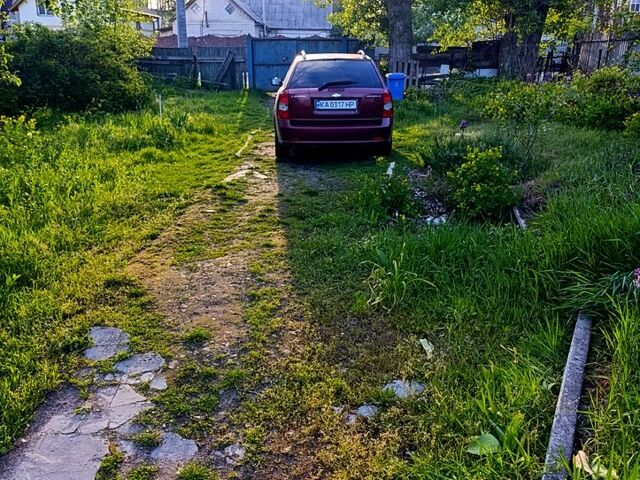 Красный Шевроле Лачетти, объемом двигателя 1.8 л и пробегом 300 тыс. км за 4750 $, фото 6 на Automoto.ua