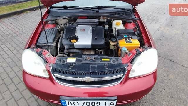 Красный Шевроле Лачетти, объемом двигателя 1.8 л и пробегом 235 тыс. км за 3900 $, фото 11 на Automoto.ua