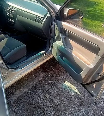 Серый Шевроле Лачетти, объемом двигателя 1.8 л и пробегом 298 тыс. км за 2250 $, фото 2 на Automoto.ua