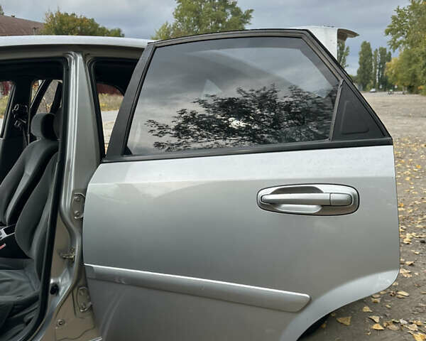 Серый Шевроле Лачетти, объемом двигателя 1.6 л и пробегом 255 тыс. км за 3600 $, фото 23 на Automoto.ua