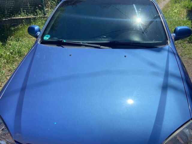 Синий Шевроле Лачетти, объемом двигателя 1.8 л и пробегом 142 тыс. км за 5000 $, фото 2 на Automoto.ua