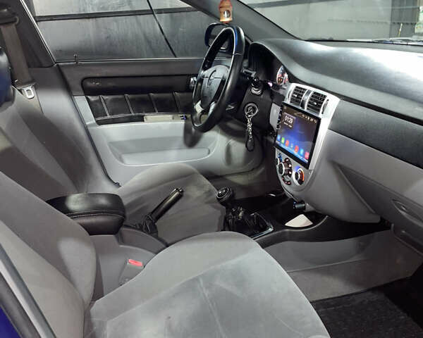 Синій Шевроле Лачетті, об'ємом двигуна 1.8 л та пробігом 251 тис. км за 4200 $, фото 12 на Automoto.ua