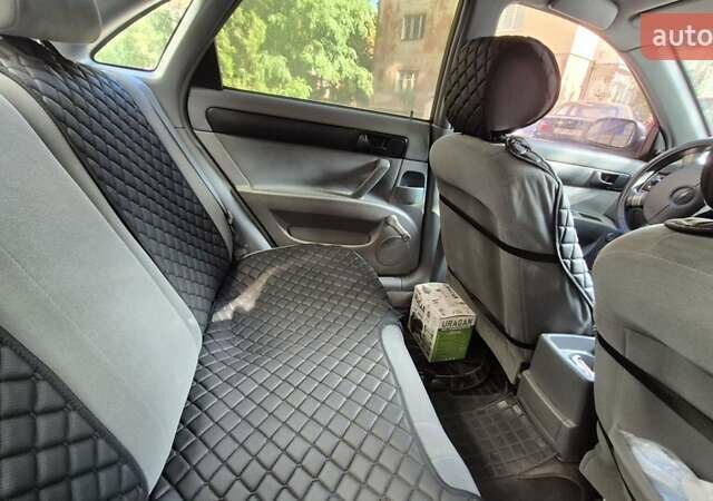 Синий Шевроле Лачетти, объемом двигателя 1.6 л и пробегом 243 тыс. км за 3800 $, фото 14 на Automoto.ua