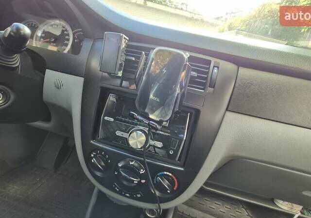 Синий Шевроле Лачетти, объемом двигателя 1.6 л и пробегом 243 тыс. км за 3800 $, фото 13 на Automoto.ua