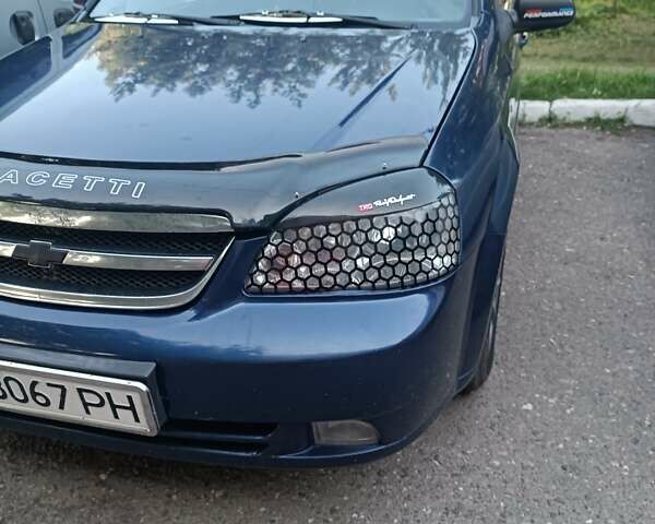 Синий Шевроле Лачетти, объемом двигателя 1.6 л и пробегом 290 тыс. км за 4300 $, фото 6 на Automoto.ua