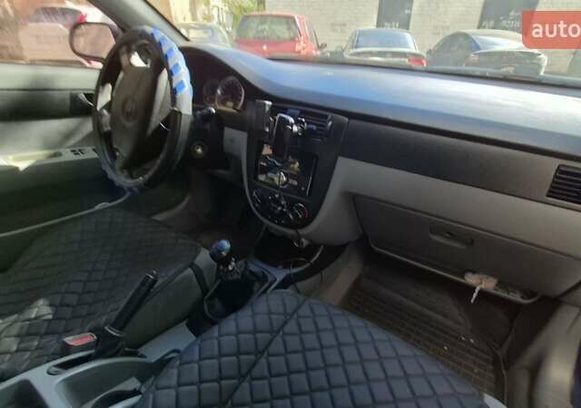 Синий Шевроле Лачетти, объемом двигателя 1.6 л и пробегом 243 тыс. км за 3800 $, фото 10 на Automoto.ua