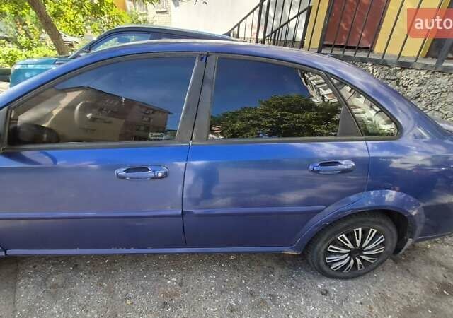 Синий Шевроле Лачетти, объемом двигателя 1.6 л и пробегом 243 тыс. км за 3800 $, фото 2 на Automoto.ua