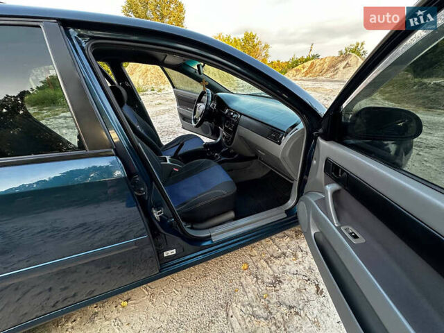 Синий Шевроле Лачетти, объемом двигателя 1.6 л и пробегом 290 тыс. км за 5000 $, фото 4 на Automoto.ua