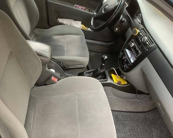 Синій Шевроле Лачетті, об'ємом двигуна 1.8 л та пробігом 335 тис. км за 4000 $, фото 8 на Automoto.ua