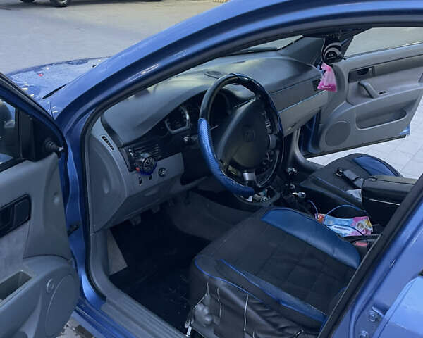 Синий Шевроле Лачетти, объемом двигателя 1.6 л и пробегом 198 тыс. км за 3300 $, фото 26 на Automoto.ua