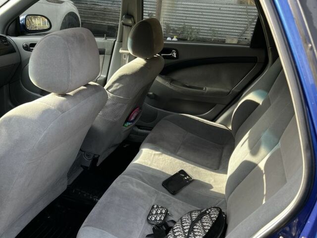 Синий Шевроле Лачетти, объемом двигателя 1.8 л и пробегом 200 тыс. км за 3990 $, фото 3 на Automoto.ua