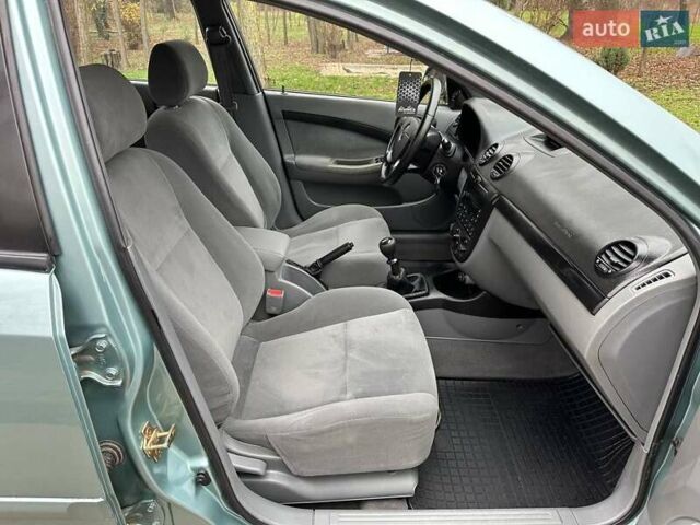 Зелений Шевроле Лачетті, об'ємом двигуна 1.8 л та пробігом 214 тис. км за 4100 $, фото 20 на Automoto.ua