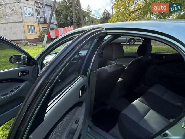 Зелений Шевроле Лачетті, об'ємом двигуна 1.8 л та пробігом 225 тис. км за 3950 $, фото 10 на Automoto.ua