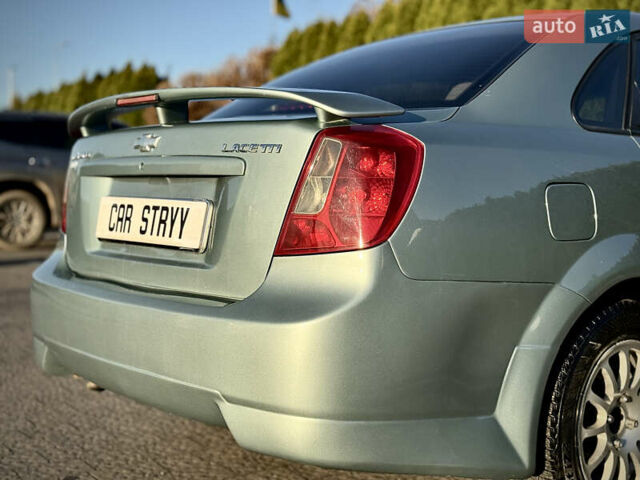 Зелений Шевроле Лачетті, об'ємом двигуна 1.8 л та пробігом 296 тис. км за 4200 $, фото 22 на Automoto.ua