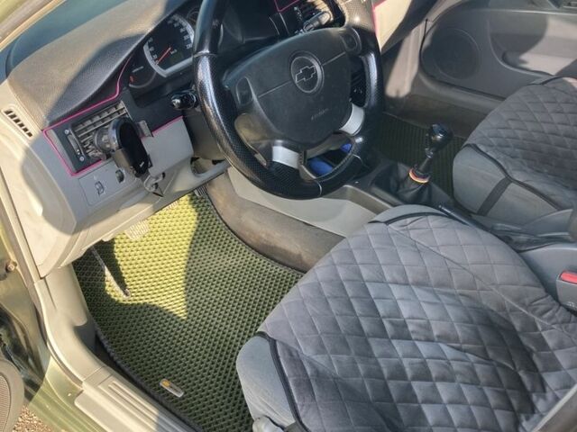 Зеленый Шевроле Лачетти, объемом двигателя 1.6 л и пробегом 280 тыс. км за 3800 $, фото 7 на Automoto.ua