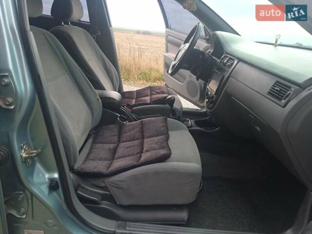 Зелений Шевроле Лачетті, об'ємом двигуна 1.6 л та пробігом 255 тис. км за 3999 $, фото 25 на Automoto.ua
