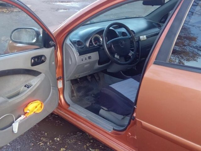 Оранжевый Шевроле Лачетти, объемом двигателя 1.6 л и пробегом 270 тыс. км за 3200 $, фото 4 на Automoto.ua